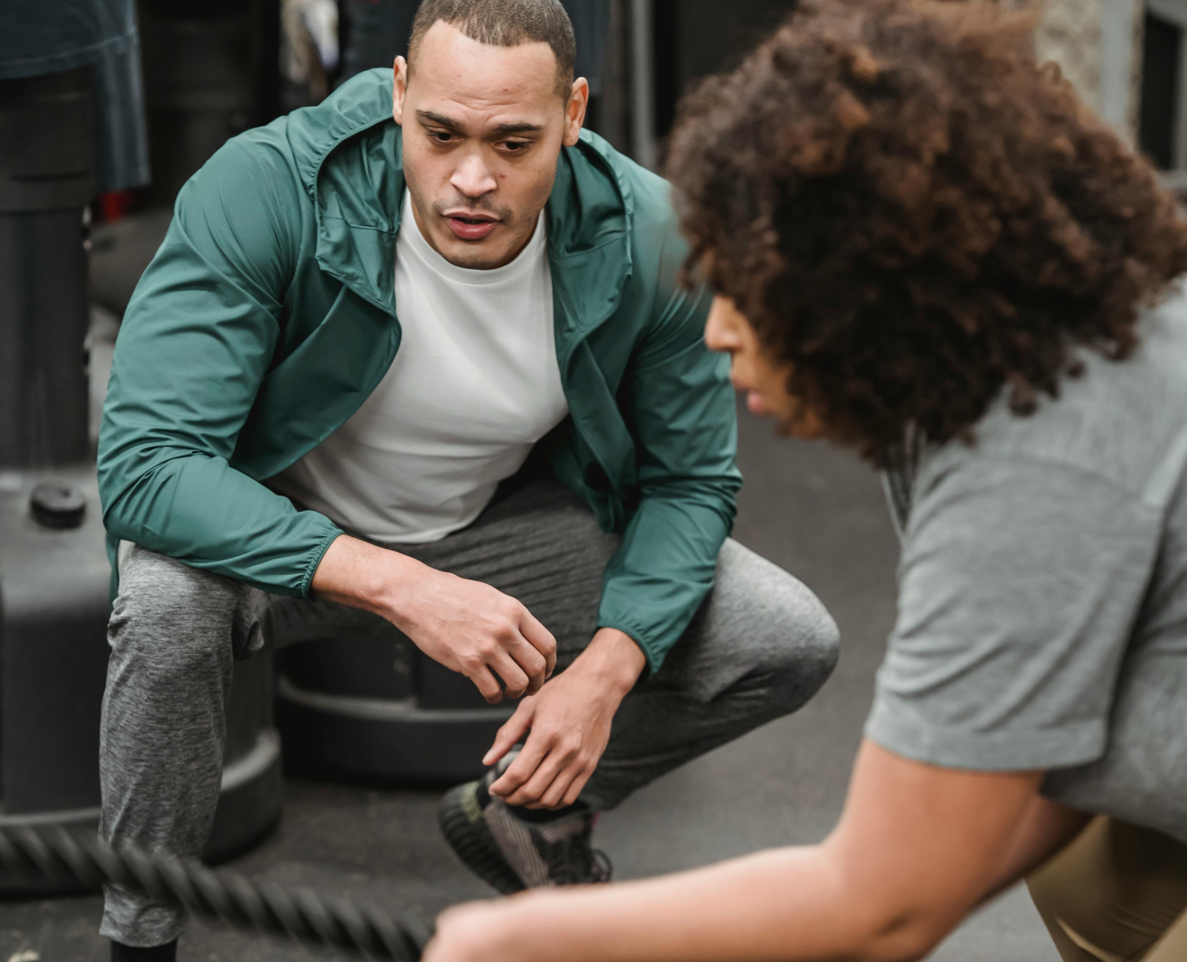 Fitness trainer coaching a client